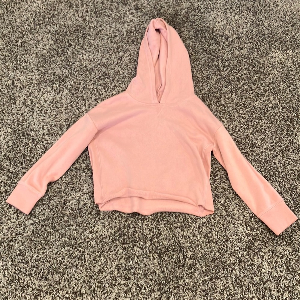 This is a cropped pink sweater and it is great for winter.